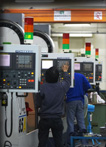 In-house production floor with CNC machine center.