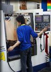 In-house production floor with CNC machine center.