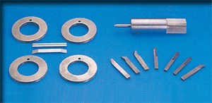 Carbide tooling for spring machine.